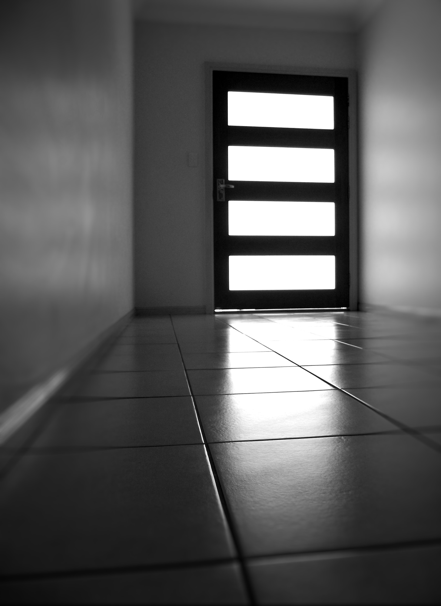 Tiled floor leading towards the front door